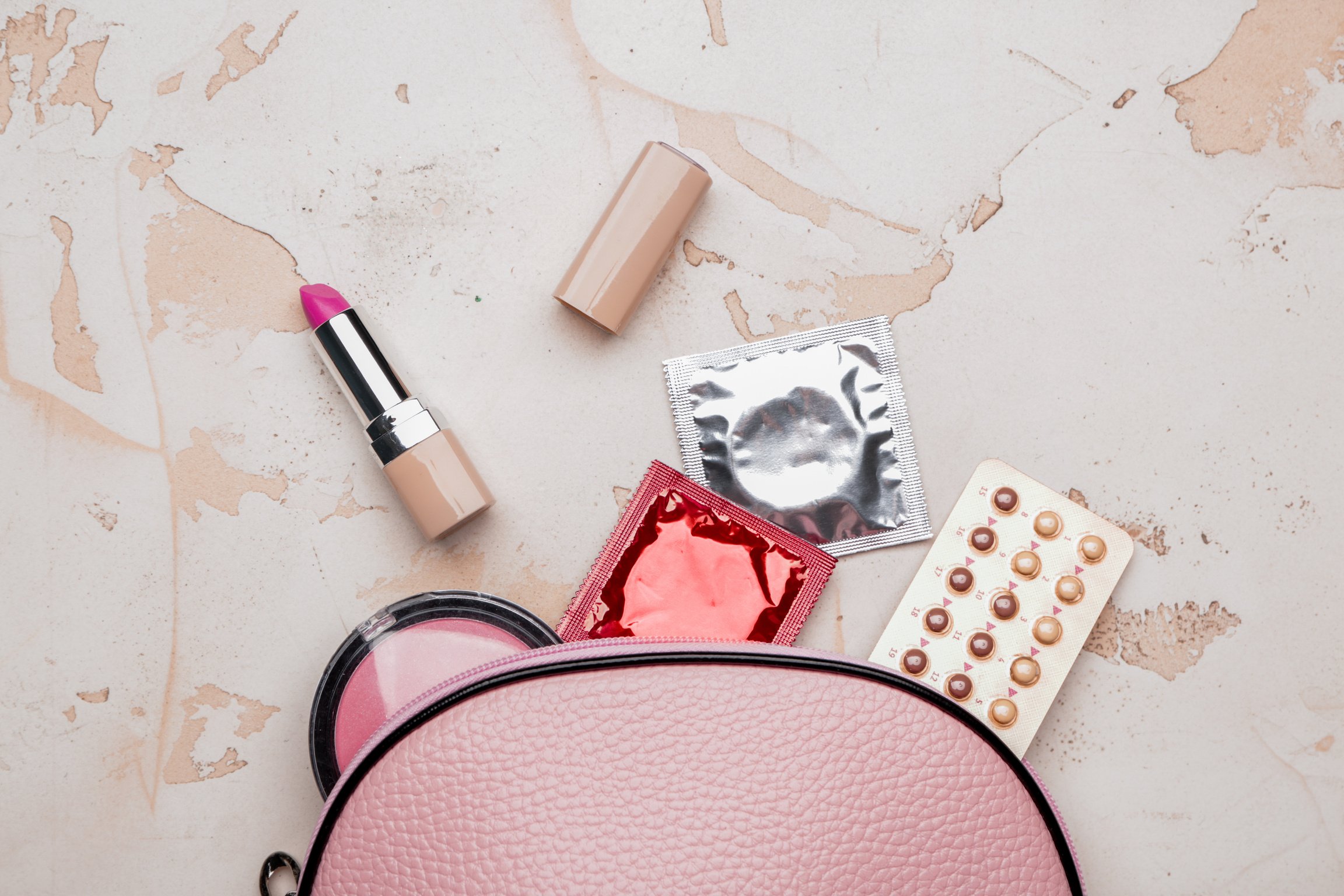 Bag with Contraceptive Pills, Condoms and Cosmetics